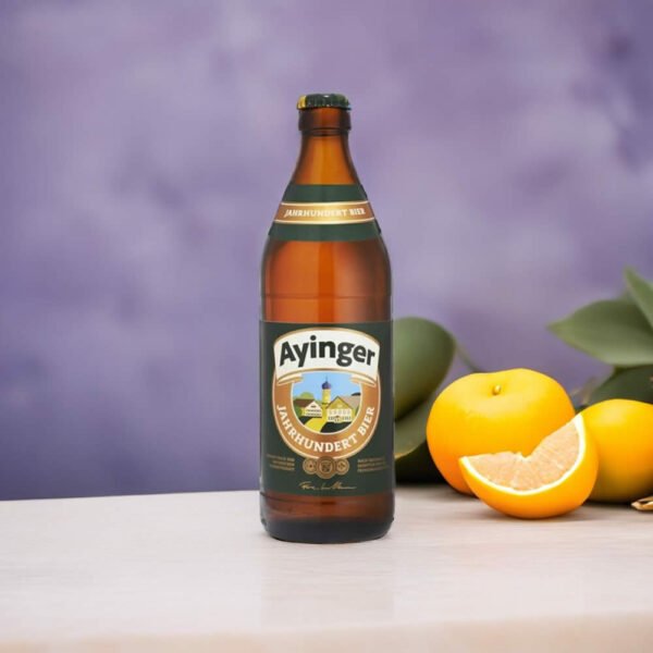 Cerveza Ayinger Jahrhundert junto a una naranja