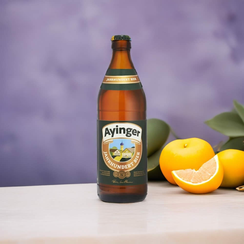 Cerveza Ayinger Jahrhundert junto a una naranja